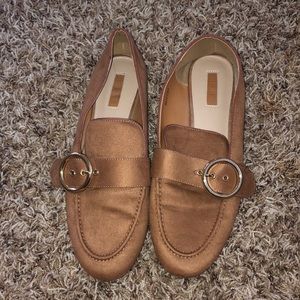 Brown buckle flats